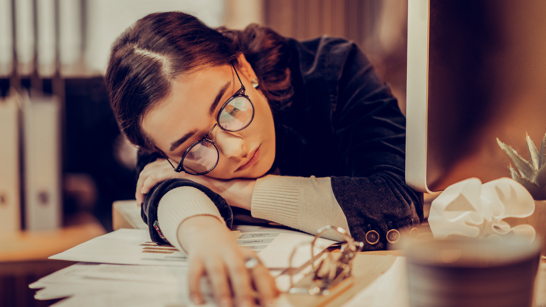 Person with ADHD experiencing burnout while working at computer